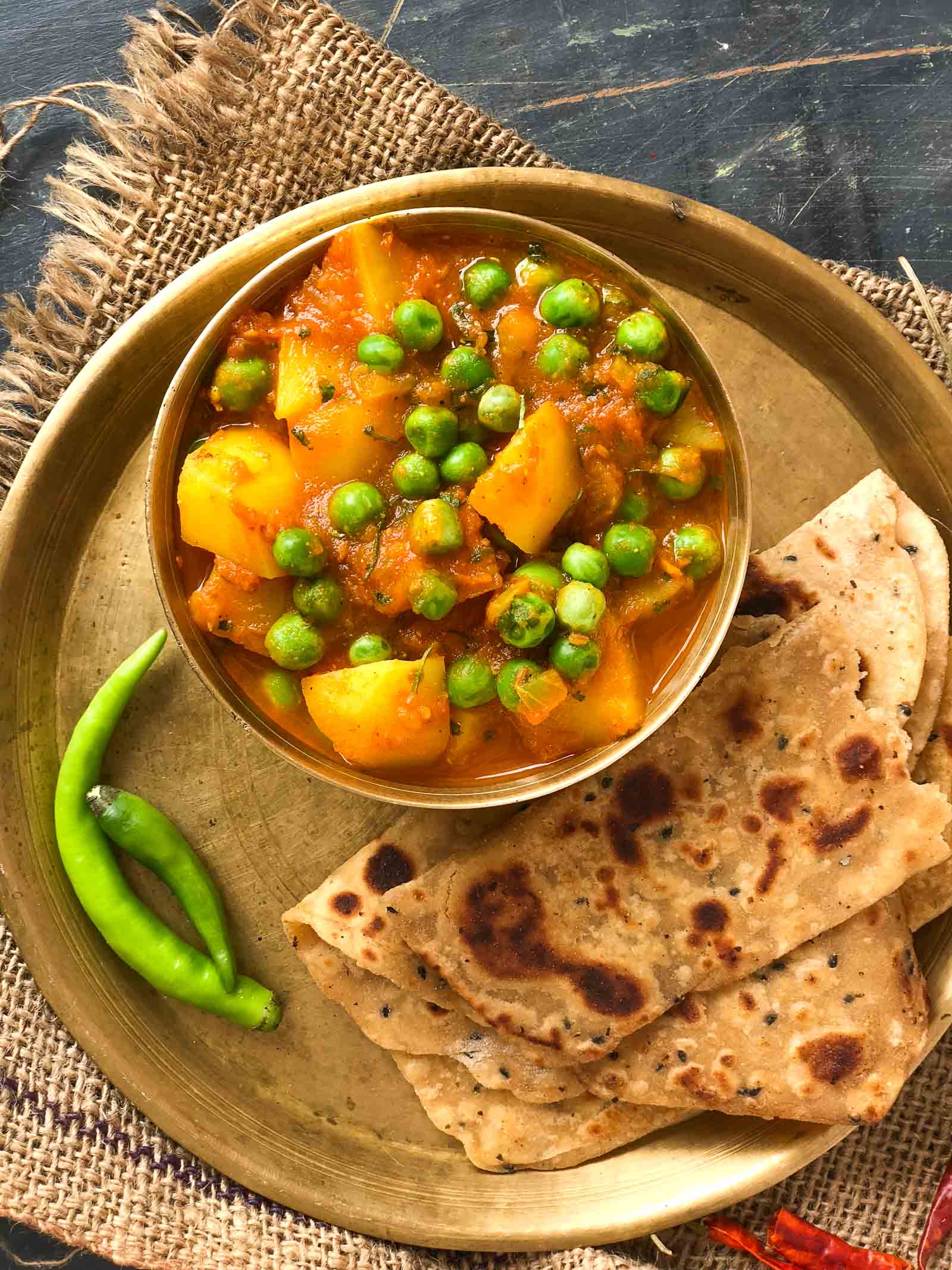 Aloo Matar Sabzi Recipe Potatoes Peas In Tomato Gravy By Archana s 