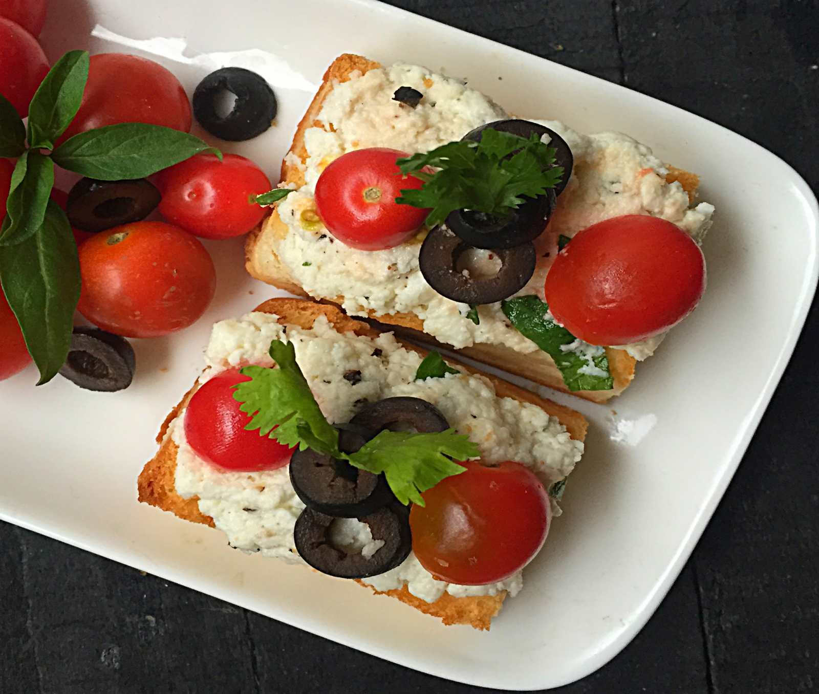 Italian Ricotta Crostini with Olives and Cherry Tomatoes Recipe