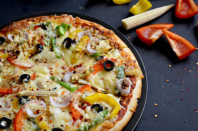 Garlic Crust Vegetable Pizza Recipe by Archana's Kitchen