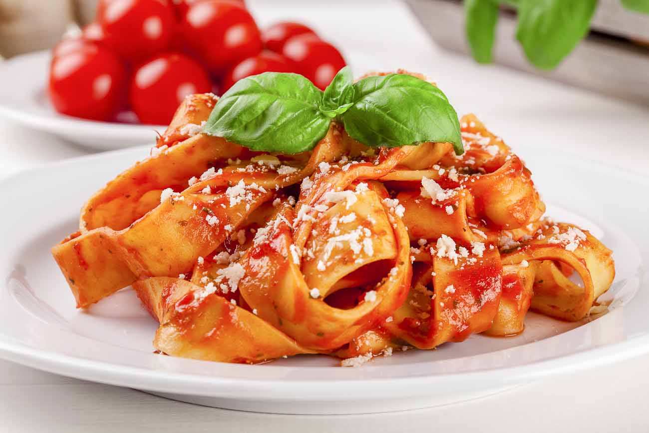 Fettuccine Pasta Recipe In Tomato Basil Sauce by Archana's Kitchen